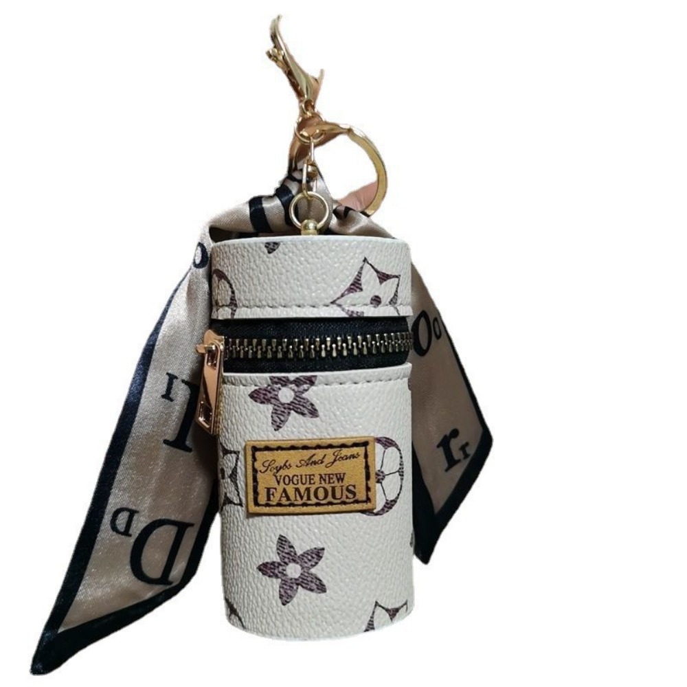 Monogram Keychain Leather - オフホワイトの花柄モノグラム円筒形ミニリップスティックケース、ブラックゴールドジッパー付きイヤホン・コイン収納ポーチ、ゴールドロブスタークラスプ＆レターシルクスカーフペンダント付き、ポータブルキーホルダー、小型アクセサリーバッグ